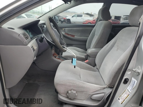2004 Toyota Corolla CE with VIN 1NXBR32E34Z297414, listed as a Copart auction lot 52541105 with 147,072 mi miles and Salvage Title. Bid and sale history available at DreamBid. Image 7.
