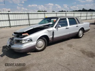 1995 Lincoln Town Car Cartier with VIN 1LNLM83W4SY673261, listed as a Copart auction lot 56045235 with Not provided miles and Salvage title. Bid and sale history available at DreamBid. Image 1.