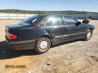 2000 Mercedes-Benz E-Class AWD with VIN WDBJF82JXYX035315, listed as a Copart auction lot 75568454 with 166,704 mi miles and Salvage Title. Bid and sale history available at carsss.com. Image 3.