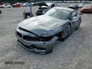 2011 BMW Z4 sDrive35is with VIN WBALM1C50BE633213, listed as a Copart auction lot 61220135 with 62,458 mi miles and Salvage title. Bid and sale history available at DreamBid. Image 13.