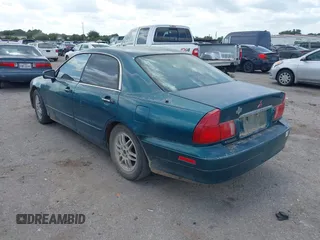 2001 Mitsubishi Diamante LS z VIN 6MMAP67P51T007599, wystawiony jako IAAI lot #42425149 z przebiegiem 115 132 mil mil oraz . Historia ofert i sprzedaży dostępna na DreamBid. Obrazek 3.