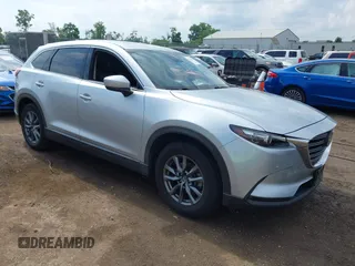 2021 Mazda CX-9 Touring z VIN JM3TCBCY5M0542080, wystawiony jako IAAI lot #42712329 z przebiegiem 39 135 mil mil oraz . Historia ofert i sprzedaży dostępna na DreamBid. Obrazek 1.