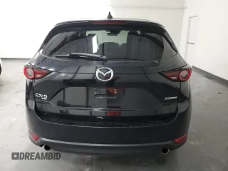 2021 Mazda CX-5 Touring with VIN JM3KFBCMXM0338844, listed as a Copart auction lot 53201615 with 137,498 mi miles and Clean Title. Bid and sale history available at carsss.com. Image 6.