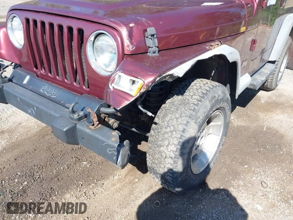 2002 Jeep Wrangler Sport with VIN 1J4FA49SX2P713303, listed as a IAAI auction lot 42136848 with 152,822 mi miles. Bid and sale history available at carsss.com. Image 6.