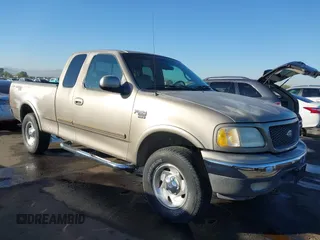 2001 Ford F-150 XL with VIN 1FTRX18L31NA75349, listed as a IAAI auction lot 40921255 with 165,872 mi miles. Bid and sale history available at carsss.com. Image 1.