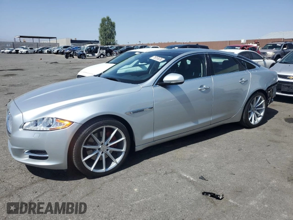2015 Jaguar XJ with VIN SAJWJ1CD4F8V82496, listed as a Copart auction lot 71013474 with 52,744 mi miles and Salvage title. Bid and sale history available at DreamBid. Image 1.