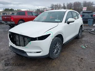 2019 Mazda CX-5 Sport with VIN JM3KFBBM2K0629966, listed as a IAAI auction lot 41953702 with 48,496 mi miles and . Bid and sale history available at DreamBid. Image 2.