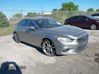 2015 Mazda 6 i Grand Touring with VIN JM1GJ1W58F1212961, listed as a IAAI auction lot 41829596 with 152,308 mi miles. Bid and sale history available at carsss.com. Image 1.