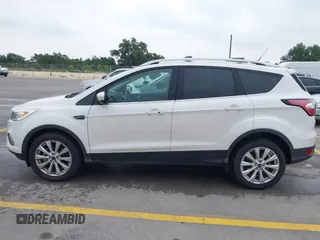 2018 Ford Escape Titanium with VIN 1FMCU9J98JUB87867, listed as a IAAI auction lot 42300123 with 48,357 mi miles and . Bid and sale history available at DreamBid. Image 14.