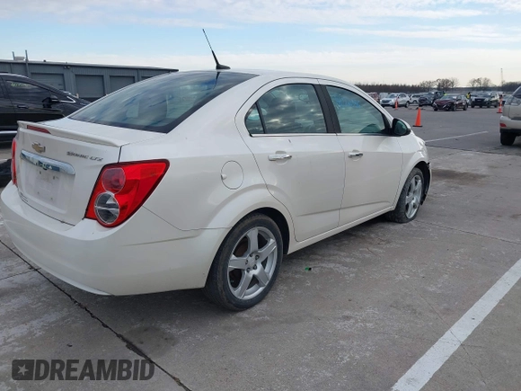 2014 Chevrolet Sonic LTZ with VIN 1G1JE5SH3E4133088, listed as a IAAI auction lot 41072056 with 143,855 mi miles. Bid and sale history available at carsss.com. Image 4.