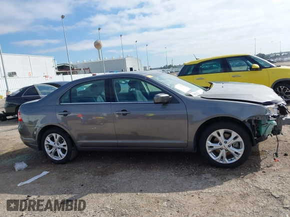 2012 Ford Fusion SE z VIN 3FAHP0HG0CR436745, wystawiony jako IAAI lot #41598812 z przebiegiem 116 305 mil mil oraz . Historia ofert i sprzedaży dostępna na DreamBid. Obrazek 14.