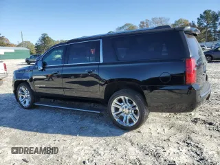 2019 Chevrolet Suburban Premier with VIN 1GNSKJKJXKR323704, listed as a Copart auction lot 72757214 with 150,404 mi miles and Salvage Title. Bid and sale history available at DreamBid. Image 2.