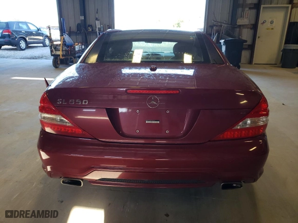 2009 Mercedes-Benz SL-Class V8 with VIN WDBSK71F29F142731, listed as a Copart auction lot 57281054 with 109,912 mi miles and Salvage Title. Bid and sale history available at carsss.com. Image 6.