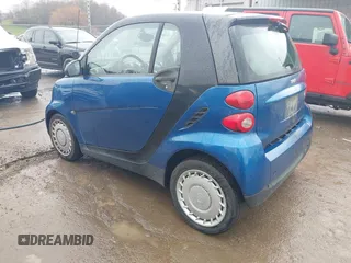 2009 Smart fortwo Pure with VIN WMEEJ31X69K312553, listed as a IAAI auction lot 41957660 with 156,476 mi miles. Bid and sale history available at carsss.com. Image 3.