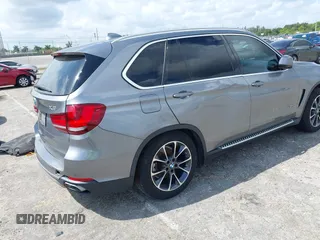 2016 BMW X5 xDrive40e with VIN 5UXKT0C58G0S75938, listed as a IAAI auction lot 42021138 with 97,426 mi miles and . Bid and sale history available at DreamBid. Image 4.