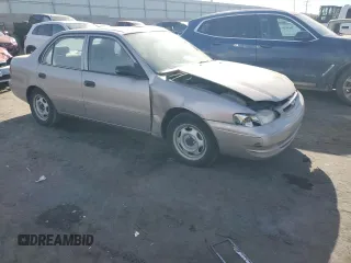 1999 Toyota Corolla VE with VIN 2T1BR12E2XC249817, listed as a Copart auction lot 86552414 with Not provided miles and Salvage title. Bid and sale history available at DreamBid. Image 4.