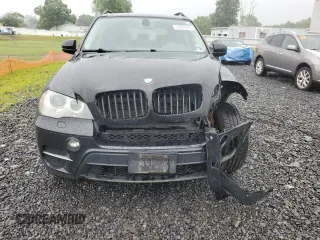 2012 BMW X5 35i with VIN 5UXZV4C57CL765053, listed as a Copart auction lot 59997275 with 157,943 mi miles and Salvage title. Bid and sale history available at DreamBid. Image 5.