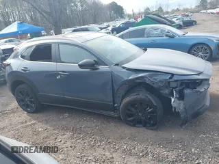 2023 Mazda CX-30 S Carbon Edition with VIN 3MVDMBCM8PM502891, listed as a IAAI auction lot 42050533 with 20,035 mi miles and . Bid and sale history available at DreamBid. Image 13.