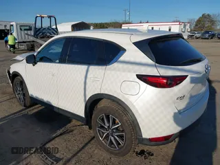 2018 Mazda CX-5 S Premium with VIN JM3KFBDM8J1419006, listed as a IAAI auction lot 41498658 with 123,622 mi miles and . Bid and sale history available at DreamBid. Image 3.