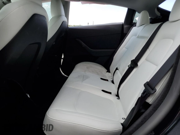 2024 Tesla Model Y Long Range with VIN 7SAYGDEE4RA285620, listed as a Copart auction lot 57883015 with 18,841 mi miles and Salvage title. Bid and sale history available at DreamBid. Image 10.