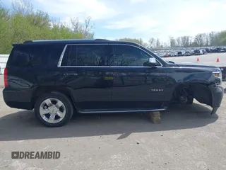 2015 Chevrolet Tahoe LTZ with VIN 1GNSKCKC8FR514671, listed as a IAAI auction lot 42157084 with 182,665 mi miles and . Bid and sale history available at DreamBid. Image 13.