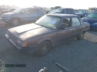 1985 Toyota Camry z VIN JT2SV12EXF0291360, wystawiony jako IAAI lot #42094530 z przebiegiem 426 444 mil mil oraz . Historia ofert i sprzedaży dostępna na DreamBid. Obrazek 2.