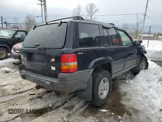 1998 Jeep Grand Cherokee Laredo with VIN 1J4GZ58SXWC293835, listed as a Copart auction lot 47557855 with 217,948 mi miles and Salvage Title. Bid and sale history available at carsss.com. Image 3.