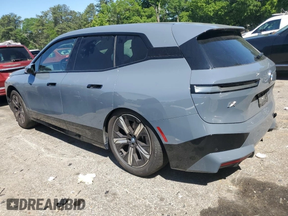 2022 BMW iX xDrive50 с VIN WB523CF00NCK44547, выставлен на аукционе Copart как лот 55262775 с пробегом 22 664 миль миль и Списание • Salvage title. История ставок и продаж доступна на DreamBid. Изображение 2.