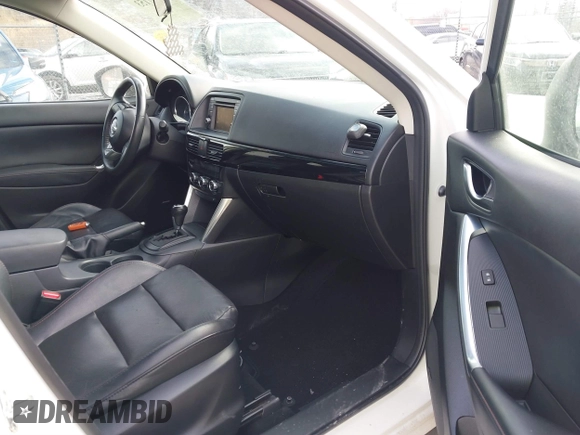 2014 Mazda CX-5 Grand Touring with VIN JM3KE4DY9E0300491, listed as a IAAI auction lot 41657153 with 157,394 mi miles and . Bid and sale history available at DreamBid. Image 5.