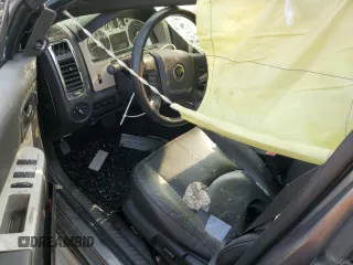 2009 Mercury Mariner Premier with VIN 4M2CU97G39KJ16748, listed as a Copart auction lot 60787005 with 191,206 mi miles and Salvage title. Bid and sale history available at DreamBid. Image 8.