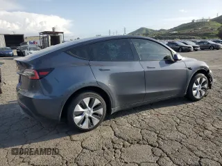2021 Tesla Model Y Standard Range with VIN 5YJYGDED7MF109418, listed as a Copart auction lot 51590135 with 86,668 mi miles and Salvage Title. Bid and sale history available at DreamBid. Image 3.