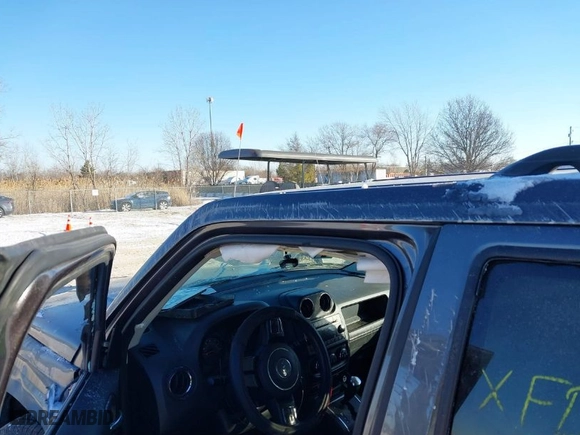2015 Jeep Patriot Altitude Edition with VIN 1C4NJPBAXFD386705, listed as a IAAI auction lot 41392260 with 163,131 mi miles. Bid and sale history available at carsss.com. Image 13.