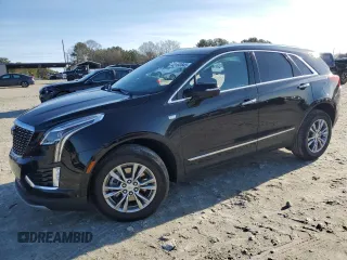 2023 Cadillac XT5 FWD Premium Luxury with VIN 1GYKNCR48PZ132957, listed as a Copart auction lot 42132845 with 27,312 mi miles and Salvage Title. Bid and sale history available at carsss.com. Image 1.