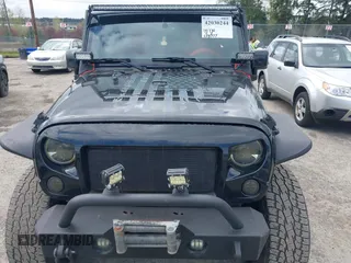 2014 Jeep Wrangler Unlimited Sahara with VIN 1C4BJWEG6EL107526, listed as a IAAI auction lot 42030244 with 69,077 mi miles. Bid and sale history available at carsss.com. Image 6.