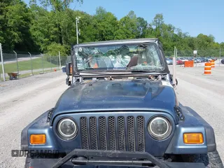 2001 Jeep Wrangler Sport z VIN 1J4FA49S11P322636, wystawiony jako IAAI lot #42409917 z przebiegiem 88 675 mil mil oraz . Historia ofert i sprzedaży dostępna na DreamBid. Obrazek 6.