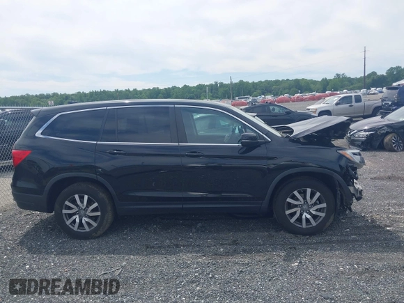 2021 Honda Pilot EX-L with VIN 5FNYF6H53MB097089, listed as a IAAI auction lot 42309359 with 58,371 mi miles and . Bid and sale history available at DreamBid. Image 14.