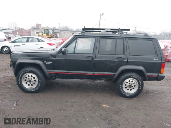 1995 Jeep Cherokee Sport with VIN 1J4FJ68S7SL572730, listed as a IAAI auction lot 41474520 with 189,907 mi miles. Bid and sale history available at carsss.com. Image 14.