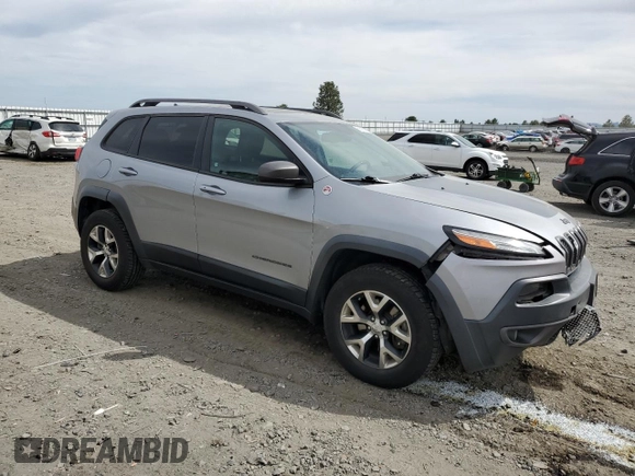 2014 Jeep Cherokee Trailhawk with VIN 1C4PJMBS6EW159174, listed as a Copart auction lot 56097795 with 130,299 mi miles and Salvage title. Bid and sale history available at DreamBid. Image 4.