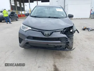 2018 Toyota RAV4 LE with VIN JTMBFREV4JJ742428, listed as a IAAI auction lot 41912813 with 114,159 mi miles. Bid and sale history available at carsss.com. Image 13.