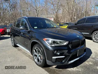 2017 BMW X1 xDrive28i with VIN WBXHT3C32H5F67896, listed as a IAAI auction lot 41823288 with 80,130 mi miles. Bid and sale history available at carsss.com. Image 1.