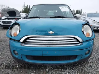 2009 MINI Cooper Hardtop with VIN WMWMF33569TW70413, listed as a IAAI auction lot 41776589 with 85,394 mi miles. Bid and sale history available at carsss.com. Image 6.