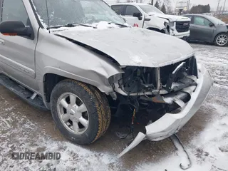 2005 GMC Envoy SLT with VIN 1GKDT13S352258640, listed as a IAAI auction lot 41226997 with 159,665 mi miles. Bid and sale history available at carsss.com. Image 6.