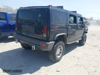 2005 Hummer H2 SUV with VIN 5GRGN23U25H128791, listed as a IAAI auction lot 42115436 with 286,818 mi miles. Bid and sale history available at carsss.com. Image 4.