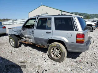 1997 Jeep Grand Cherokee Laredo with VIN 1J4GZ58S5VC561060, listed as a Copart auction lot 52098315 with 267,245 mi miles and Salvage title. Bid and sale history available at DreamBid. Image 2.