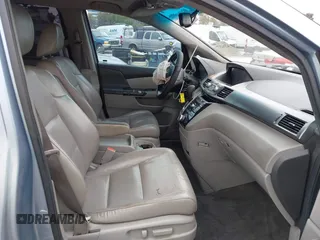 2012 Honda Odyssey EX-L with VIN 5FNRL5H66CB061847, listed as a IAAI auction lot 42162377 with 217,204 mi miles and . Bid and sale history available at DreamBid. Image 5.
