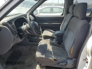2000 Nissan Frontier XE with VIN 1N6ED27T8YC436513, listed as a Copart auction lot 60338695 with 307,757 mi miles and Clean title. Bid and sale history available at DreamBid. Image 7.