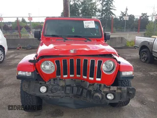 2018 Jeep Wrangler Unlimited Sahara with VIN 1C4HJXEG1JW310817, listed as a IAAI auction lot 42248374 with 64,516 mi miles and . Bid and sale history available at DreamBid. Image 13.
