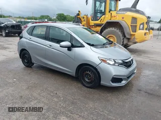 2019 Honda Fit LX z VIN 3HGGK5H46KM723835, wystawiony jako IAAI lot #42122386 z przebiegiem 117 928 mil mil oraz . Historia ofert i sprzedaży dostępna na DreamBid. Obrazek 1.