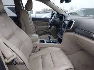 2014 Jeep Grand Cherokee Overland with VIN 1C4RJECG5EC207211, listed as a IAAI auction lot 41586309 with 115,293 mi miles. Bid and sale history available at carsss.com. Image 5.