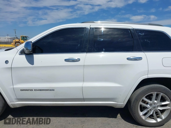 2015 Jeep Grand Cherokee Overland with VIN 1C4RJFCG3FC230185, listed as a IAAI auction lot 42494650 with 123,128 mi miles and . Bid and sale history available at DreamBid. Image 14.